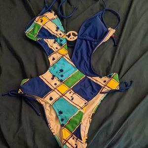 Peace one piece bathsuit with side ties